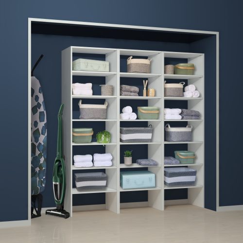 White shelf units in a linen cupboard with room for tall storage ironing board and vacuum